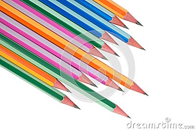 Many wood pencil crayons of different colors arranged in a wonderful line on a paper Stock Photo