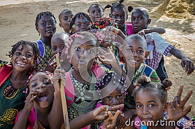 Many young African children with beautifully decorated hair making faces for the camera, Cabinda, Angola, Africa Editorial Stock Photo