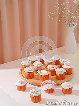 Many yummy cupcakes. Valentine sweet love cupcake on table on light background Stock Photo