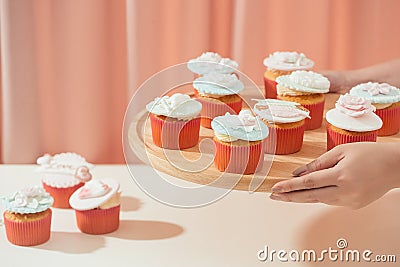 Many yummy cupcakes. Valentine sweet love cupcake on table on light background Stock Photo