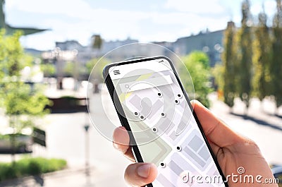 Map app in mobile phone to search location or navigate to destination in city. Place marker and pointer icon. Online GPS guide. Stock Photo