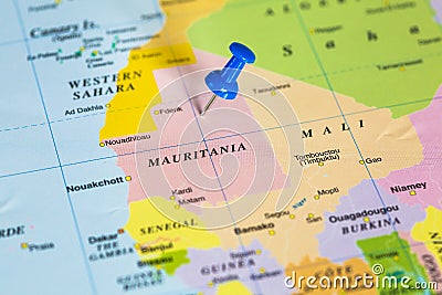 Map of Mauritania with a blue pushpin stuck Stock Photo