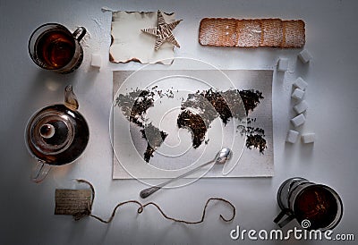 Map of the world, lined with tea leaves. Eurasia, America, Australia, Africa. vintage. sugar, note, cracker, spoon . top Stock Photo