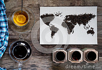 Map of the world, lined with tea leaves on old paper. Eurasia, America, Australia, Africa. vintage. green tea, a towel Stock Photo