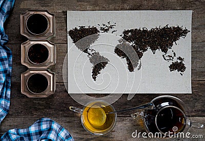 Map of the world, lined with tea leaves on old paper. Eurasia, America, Australia, Africa. vintage. green tea, a towel Stock Photo