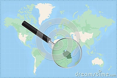 Map of the world with a magnifying glass on a map of Tanzania Vector Illustration