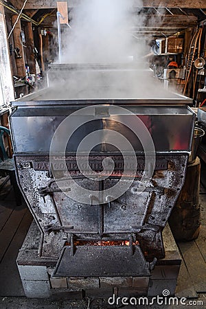 A maple syrup evaporator and boiler in a New Hampshire sugar shack. Editorial Stock Photo