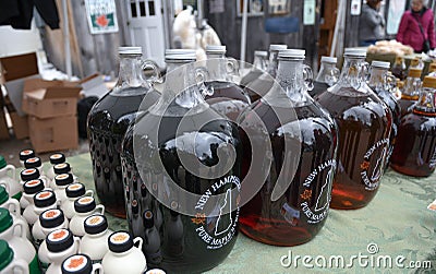 Bottles of fresh maple syrup for sale at Ben`s Sugar Shack in Temple, N.H., USA, March 24, 2018. Editorial Stock Photo