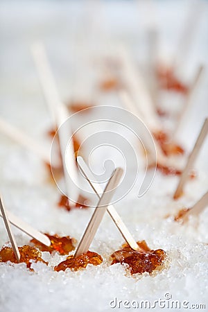 Maple taffy on ice Stock Photo