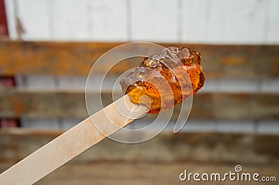 Maple taffy on a stick Stock Photo
