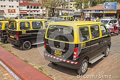 Indian taxi stand with black yellow cars Editorial Stock Photo