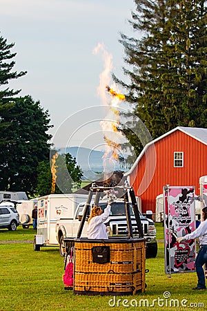 Marathon City, Wisconsin, USA, July 10, 2021, Taste N Glow Balloon Fest. People testing the burners of their hot air balloons Editorial Stock Photo
