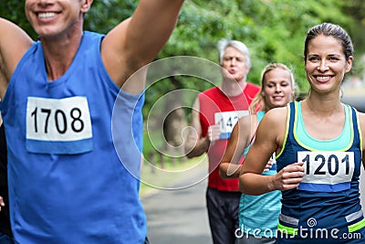 Marathon male athlete crossing the finish line Stock Photo