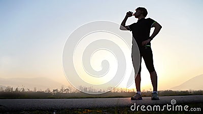 Marathon runner drinks water on the wide angle mountain landscape. Hight Definition Video : 29.97 FPS 14sec Please look another footages on my Train_Arrival Marathon runner drinks water on the wide angle mountain landscape. Hight Definition Video : 29.97 FPS 14sec Please look another footages on my Train_Arrival