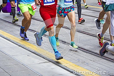 Marathon runners race in city streets Editorial Stock Photo