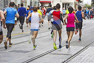 Marathon runners race in city streets Editorial Stock Photo