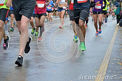 Marathon running race, many runners feet on road racing, sport competition, fitness and healthy lifestyle Stock Photo