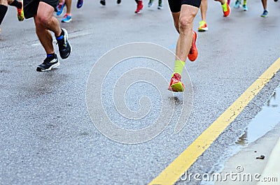 Marathon running race, many runners feet on road racing, sport competition, fitness and healthy lifestyle Stock Photo