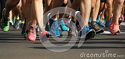 Marathon running race people feet on city road Stock Photo