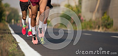 Marathon running race, runners feet on road Stock Photo