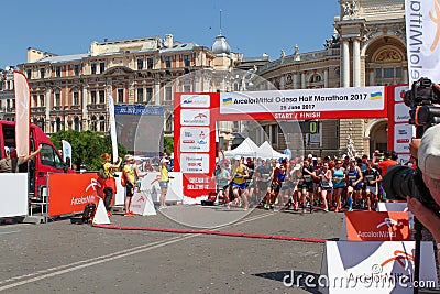 Marathon, starting line. Marathon runners at sunny summer day Editorial Stock Photo