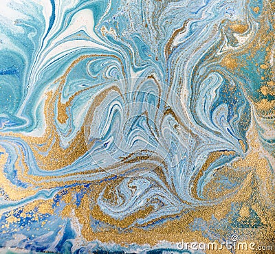 Marble abstract acrylic background. Blue marbling artwork texture. Golden glitter. Stock Photo