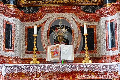 Marble altar with holy bible and candlesticks at Christmas Stock Photo