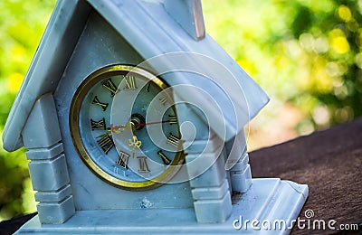 Marble clock on wood Stock Photo