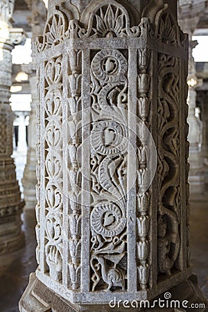 Marble column carved with a beautiful bird and flower pattern in the Jain temple Adinatha temple in Ranakpur, Rajasthan, India Stock Photo