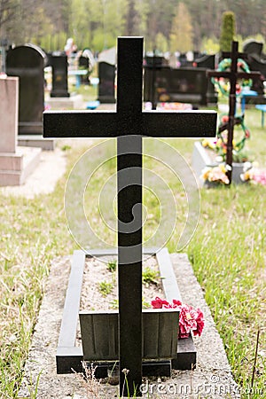 Marble cross over the grave Stock Photo