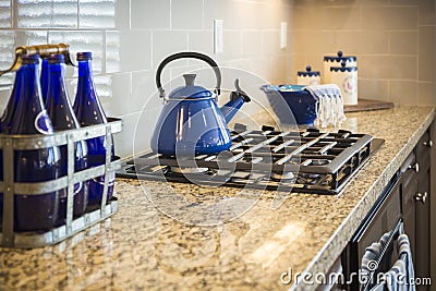 Marble Kitchen Counter and Stove With Cobalt Blue Decor Stock Photo