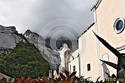 Marble quarries in Colonnata and monument to the quarryman. The town is famous for the lardo di Colonnata and for the extraction Editorial Stock Photo