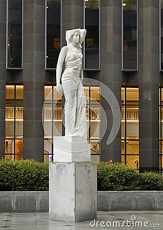 Marble statue of a classic female figure by Marton Varo in front of the Plaza of the Americas Editorial Stock Photo