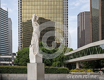 Marble statue of a classic female figure by Marton Varo in front of the Plaza of the Americas Editorial Stock Photo