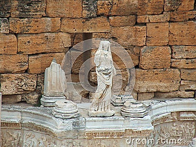 Ruined amphitheater. Statue of goddess Turkey. Stock Photo