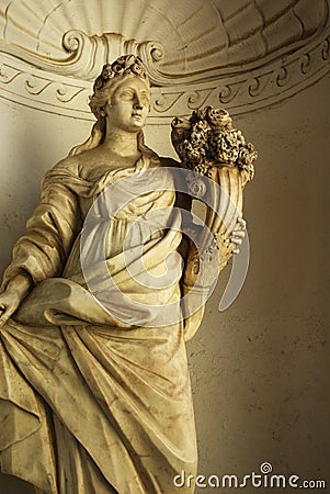 Marble statue - woman with cone of flowers Stock Photo