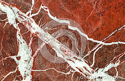 Red marble texture macro shot. Quality marble with white veins. Stone backgrounds. Stock Photo