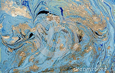 Marbled blue abstract background with golden sequins. Liquid marble ink pattern. Stock Photo