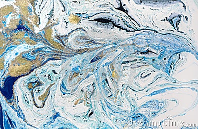 Marbled blue abstract background with golden sequins. Liquid marble ink pattern. Stock Photo