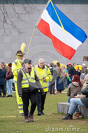 7 March, 2021, Amsterdam, Netherlands, Yellow umbrella`s protest against covid-19 measures and vaccination Editorial Stock Photo