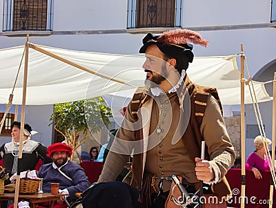 A young dark-haired spanish man in a medieval aristocratic costume and a hat... Editorial Stock Photo