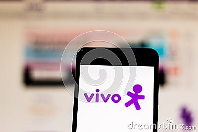 March 10, 2019, Brazil. `Vivo` brand logo on the mobile device screen. It is a concessionaire of fixed telephony, mobile telephon Editorial Stock Photo