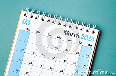 A March 2023 calendar desk for the organizer to plan and reminder isolated on blue background Stock Photo