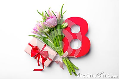 8 March greeting card design with tulips and gift on white background, top view Stock Photo