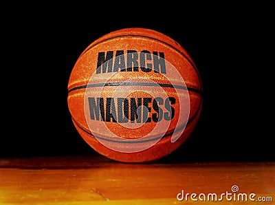 March Madness basketball on a hardwood court, college basketball tournament concept Stock Photo