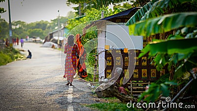 women and girl standing road side Editorial Stock Photo