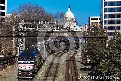 MARCH 26, 2108 - Passenger Metro train with US Capitol in background approaches L'enfant Plaza. Engine, move Editorial Stock Photo