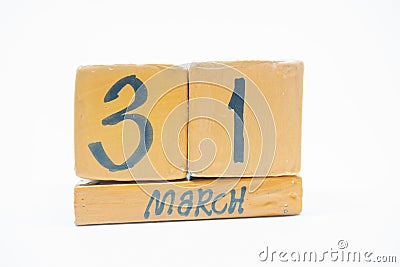 march 31st. Day 31 of month, handmade wood calendar isolated on white background. Spring month, day of the year concept Stock Photo