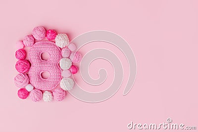 8 March symbol. Figure of eight made of handmade crochet. Happy womans day design. Stock Photo