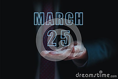 march 25th. Day 25 of month, announcement of date of business meeting or event. businessman holds the name of the month and day on Stock Photo